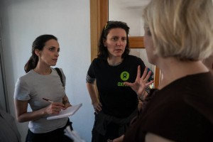 Oxfam staff interviewing people and assessing their needs