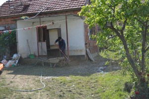 Bosnia. Nedzija Music son cleaning arround the house Bosnia. Nedzija Music son cleaning arround the house